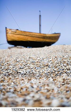 Stock Image - Fishing boats on the shingle banks of Dungeness; Kent, England. Fotosearch