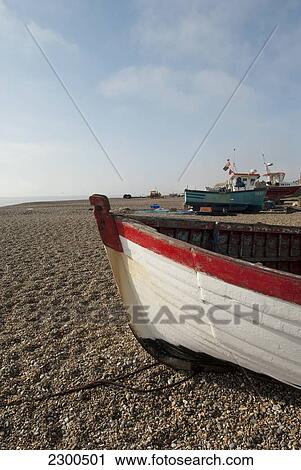 Stock Image - Fishing Boats Pulled To Shore On Aldeburgh Beach, Suffolk, Uk. Fotosearch