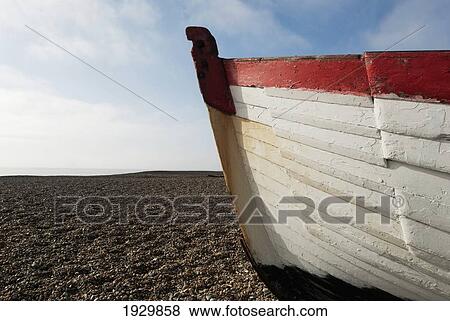 Stock Photo - Fishing boats pulled to shore on Aldeburgh beach, Suffolk, UK. Fotosearch