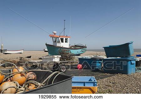 Stock Photography - Fishing boats pulled to shore on Aldeburgh beach, Suffolk, UK. Fotosearch