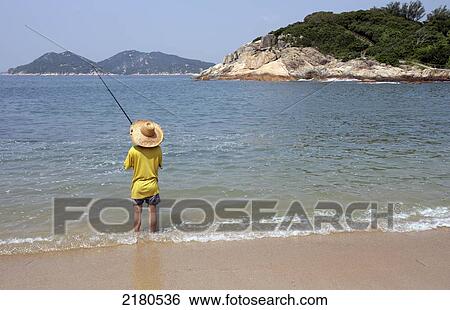 Stock Photograph - Fishing from the shore; Cheug Chau Island, Hong Kong. Fotosearch