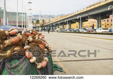 Stock Image - Fishing nets piled on the side of the road; Genoa, Liguria, Italy. Fotosearch