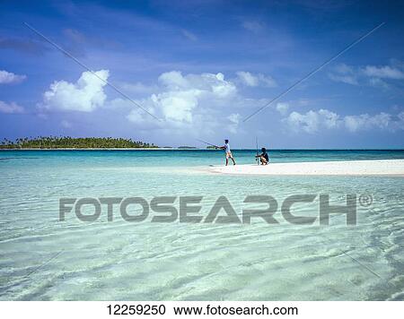 Stock Image - Fishing on an atoll; Kiribati Islands. Fotosearch