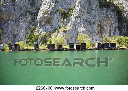 Fishing shacks on the Cetina River; Omis, Split, Croatia View Large Photo Image Stock Image - Fishing shacks on the Cetina River; Omis, Split, Croatia. Fotosearch