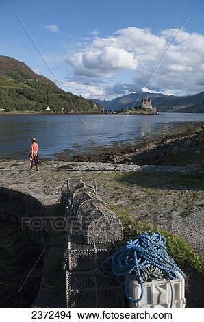 Picture - Fishing with traps on a lake; Dunan, Scotland. Fotosearch