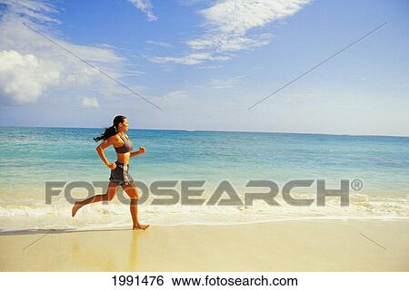 Fit Girl Jogging On The Beach View Large Photo Image Stock Photograph - Fit Girl Jogging On The Beach. Fotosearch
