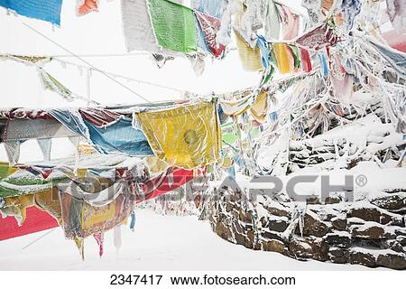 Stock Photo - Five-Color Prayer Flags With Mantras At The Snowed In High Mountain Pass, Tibet Stupa; Tibet, Sichuan, China. Fotosearch