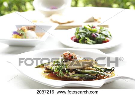 Stock Photograph - Five course tasting menu including appetizers, salad, main course, and dessert.. Fotosearch
