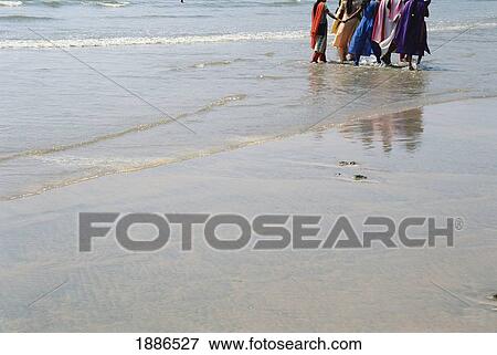 Five Women In Colorful Saris On The Beach, Goa View Large Photo Image Stock Photo - Five Women In Colorful Saris On The Beach, Goa. Fotosearch