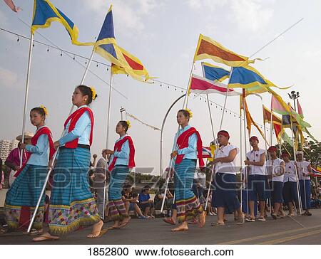 Stock Image - Flag Bearers, Flower Festival, Chiang Mai, Thailand. Fotosearch