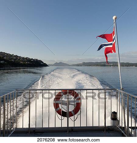 Flag Of Norway Flying On The Back Of A Boat; Sognefjord Norway View Large Photo Image Stock Photo - Flag Of Norway Flying On The Back Of A Boat; Sognefjord Norway. Fotosearch