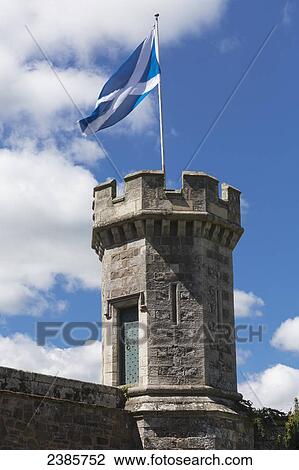 Stock Image - Flag of Scotland flying on a turret; Scottish Borders, Scotland. Fotosearch