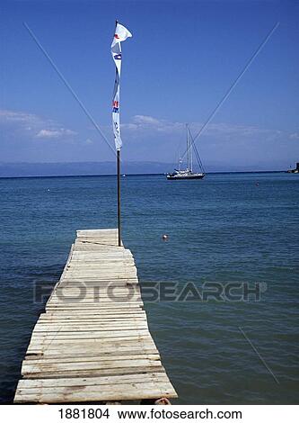 Flag On Wooden Pier At Lakka Beach View Large Photo Image Picture - Flag On Wooden Pier At Lakka Beach. Fotosearch