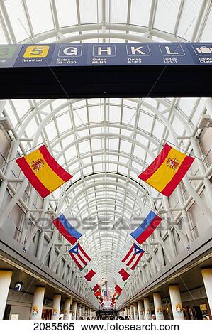 Stock Photography - Flags And Signs For Gates At The Airport; Chicago Illinois United States Of America. Fotosearch