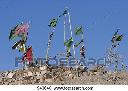 Stock Image - Flags Fluttering In The Wind Over A Muslim Cemetery In Tajekha, Vardak Province, Afghanistan. Fotosearch