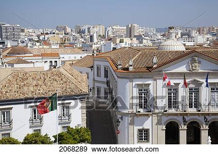 Flags On The Front Of A Building And A Cityscape With A Blue Sky; Faro Algarve Portugal View Large Photo Image Stock Photo - Flags On The Front Of A Building And A Cityscape With A Blue Sky; Faro Algarve Portugal. Fotosearch