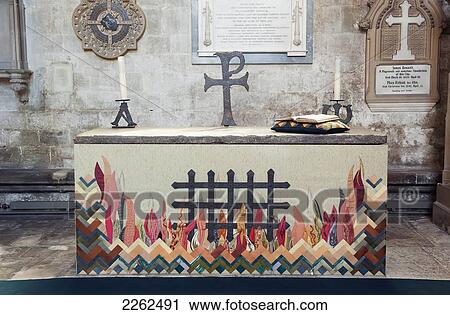 Stock Image - Flames Depicted At An Altar In Salisbury Cathedral; Salisbury England. Fotosearch