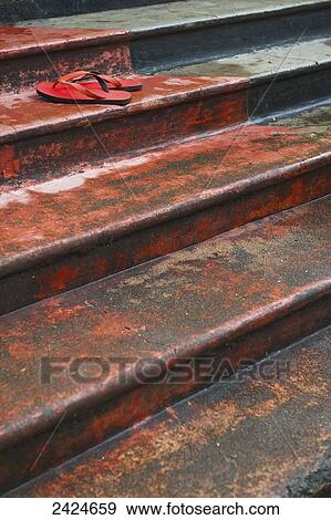 Stock Photo - Flip flops sitting on steps; Ulpotha, Embogama, Sri Lanka. Fotosearch