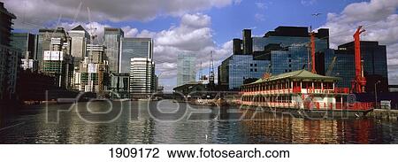 Stock Image - Floating Chinese Restaurant With Canary Wharf In Background, London, England, Uk. Fotosearch