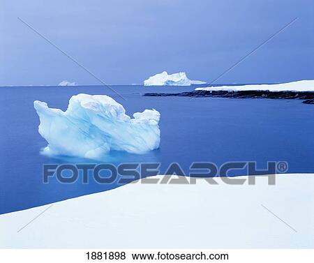 Floating Icebergs In Ocean And Coastline View Large Photo Image Stock Photo - Floating Icebergs In Ocean And Coastline. Fotosearch