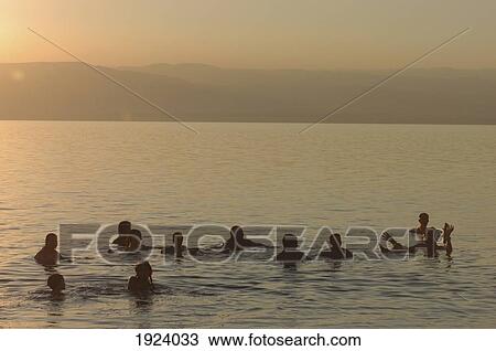 Stock Image - Floating In The Dead Sea Movenpick Spa. Fotosearch