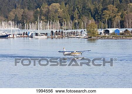 Floatplane In Burrard Inlet, Vancouver, British Columbia, Canada View Large Photo Image Stock Photograph - Floatplane In Burrard Inlet, Vancouver, British Columbia, Canada. Fotosearch