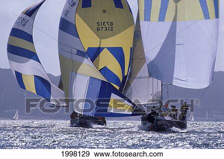 Florida, Key West Race Week, Bow View Of Two Yachts Heading To Camera, Blue White Yellow Sail Shimmery Ocean View Large Photo Image Stock Photo - Florida, Key West Race Week, Bow View Of Two Yachts Heading To Camera, Blue White Yellow Sail Shimmery Ocean. Fotosearch