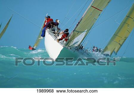 Stock Photo - Florida, Key West Race Week, Front Of Yacht, Light Blue Waters. Fotosearch