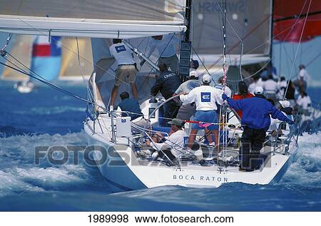 Stock Photo - Florida, Miami, Short Ocean Racing Championship (Sorc), Stern View Of Yacht Action, Many Yachts In Background Soft Focus. Fotosearch