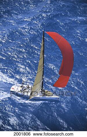 Stock Photograph - Florida, Miami, Short Ocean Racing Championship (Sorc), Aerial View Of Yacht With Sails Blowing In Wind, Cutting Through Water. Fotosearch