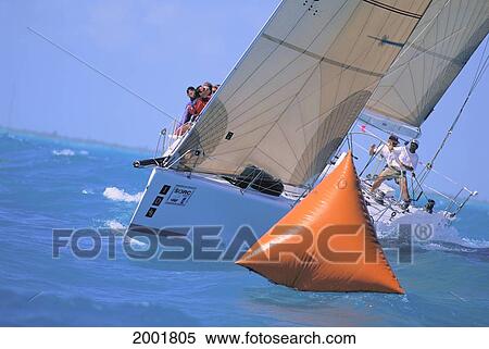 Florida, Miami, Short Ocean Racing Championship (Sorc), Bow View As Captain Cuts Around Buoy, Crew Along Starboard Side View Large Photo Image Stock Photography - Florida, Miami, Short Ocean Racing Championship (Sorc), Bow View As Captain Cuts Around Buoy, Crew Along Starboard Side. Fotosearch