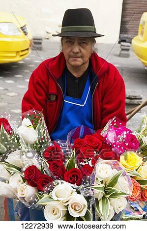 Stock Photo - Flower vendor on the Plaza de las Flores, Cuenca, Azuay, Ecuador. Fotosearch