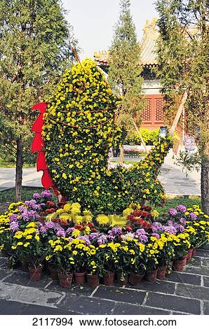 Picture - Flowers Designed In The Shape Of A Fish; Beijing China. Fotosearch