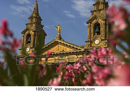 Stock Photo - Flowers In Front Of St. Publius Parish Church. Fotosearch