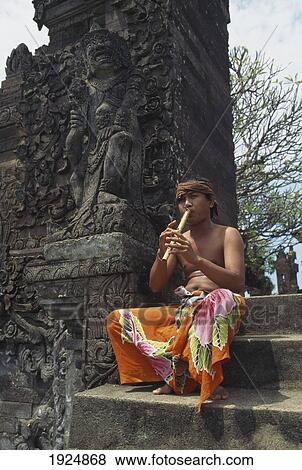 Stock Photo - Flute Player At Temple. Fotosearch