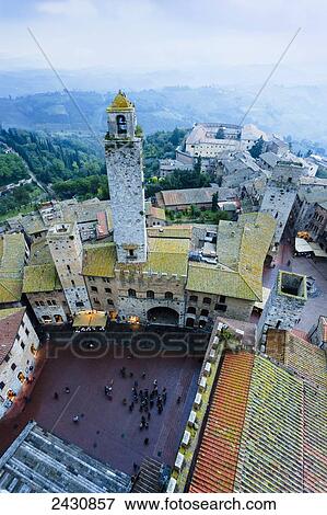 Fog covers the distant hills with a high angle view of the city; San Gimignano, Tuscany, Italy View Large Photo Image Stock Photo - Fog covers the distant hills with a high angle view of the city; San Gimignano, Tuscany, Italy. Fotosearch