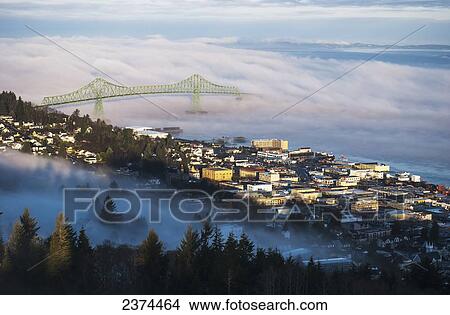 Picture - Fog hovers over the Columbia River; Astoria, Oregon, United States of America. Fotosearch