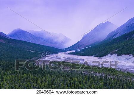 Fog Over Mountains And Dry River Bed, Stone Mountain Provincial Park, Northern British Columbia View Large Photo Image Picture - Fog Over Mountains And Dry River Bed, Stone Mountain Provincial Park, Northern British Columbia. Fotosearch