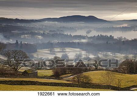 Stock Image - Fog Over The Landscape; Cumbria, England. Fotosearch