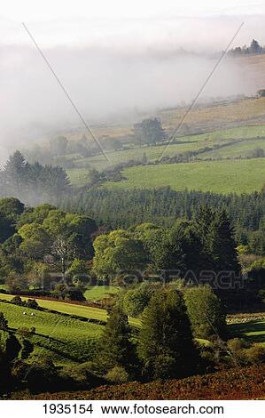 Picture - Fog Rolling Into Nire Valley; Clonmel, County Tipperary, Ireland. Fotosearch