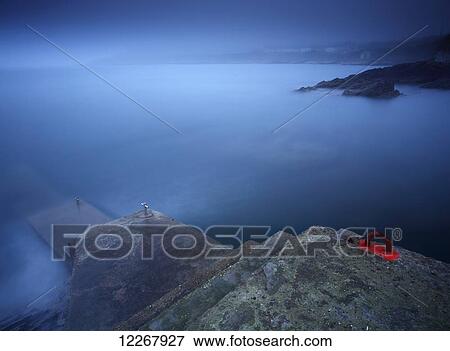 Foggy coastline around Roches Point in Cork harbour; County Cork, Ireland View Large Photo Image Stock Photo - Foggy coastline around Roches Point in Cork harbour; County Cork, Ireland. Fotosearch