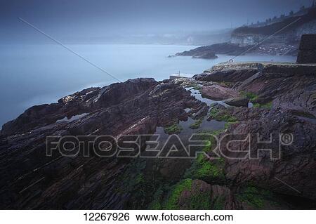 Foggy coastline around Roches Point in Cork harbour; County Cork, Ireland View Large Photo Image Stock Photograph - Foggy coastline around Roches Point in Cork harbour; County Cork, Ireland. Fotosearch