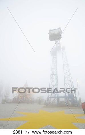 Foggy day at Tibidabo fairground above the city of Barcelona; Barcelona, Spain View Large Photo Image Stock Photo - Foggy day at Tibidabo fairground above the city of Barcelona; Barcelona, Spain. Fotosearch