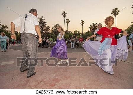 Folklore dancers at sunset on a public place; Mendoza, Argentina View Large Photo Image Stock Image - Folklore dancers at sunset on a public place; Mendoza, Argentina. Fotosearch