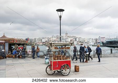 Food cart and pedestrians at the waterfront; Istanbul, Turkey View Large Photo Image Stock Image - Food cart and pedestrians at the waterfront; Istanbul, Turkey. Fotosearch