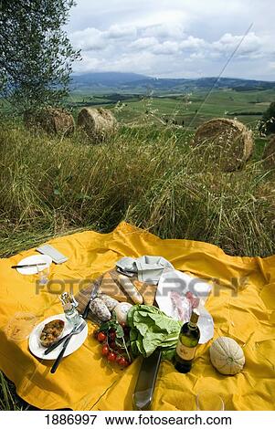 Stock Photo - Food Laid Out On A Blanket For An Italian Picnic In The Tuscan Fields. Fotosearch