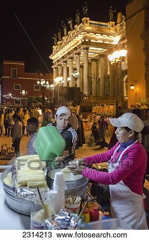 Stock Image - Food vendor in Jardin Union selling elotes; Guanajuato, Guanajuato, Mexico. Fotosearch