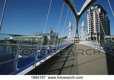 Stock Photo - Footbridge, Salford Docks & Lowry Centre. Fotosearch