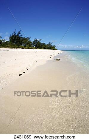 Stock Photo - Footprints in the white sand along the water's edge; Vamizi Island, Mozambique. Fotosearch