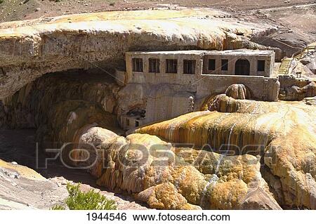 Stock Photograph - Former spa by Puente del Inca, a natural arch that forms a bridge with sulphur deposits over the Vacas River, a tributary of the Mendoza River, Mendoza, Argentina. Fotosearch